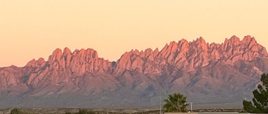 Mountain range turned pink in the sunsut.